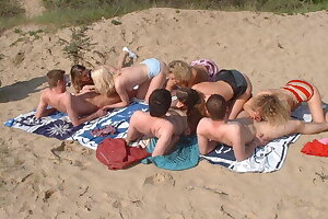 Amateur teens and moms on beach